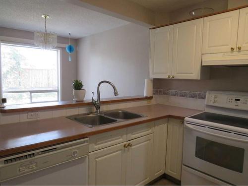 16 Catalina Circle Ne, Calgary, AB - Indoor Photo Showing Kitchen With Double Sink