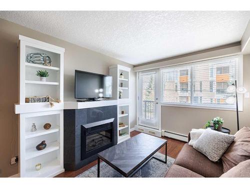 6-2104 17 Street Sw, Calgary, AB - Indoor Photo Showing Living Room With Fireplace
