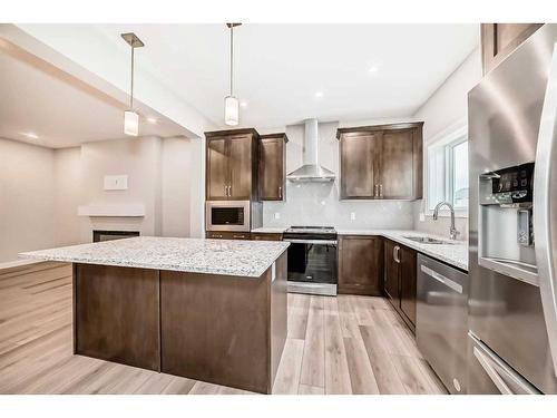 612 Baywater Manor Sw, Airdrie, AB - Indoor Photo Showing Kitchen With Upgraded Kitchen