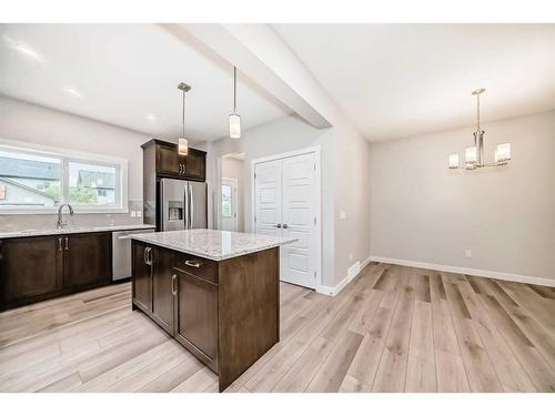 612 Baywater Manor Sw, Airdrie, AB - Indoor Photo Showing Kitchen With Upgraded Kitchen