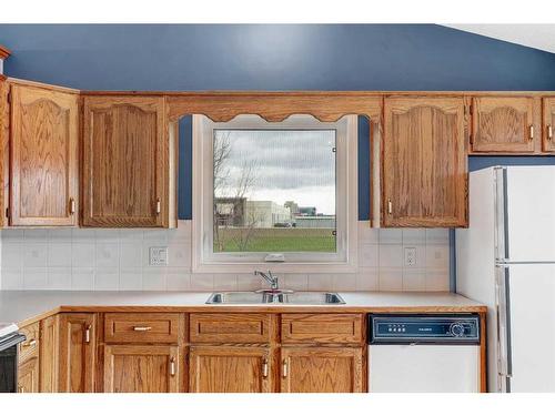79 Riverstone Crescent Se, Calgary, AB - Indoor Photo Showing Kitchen With Double Sink