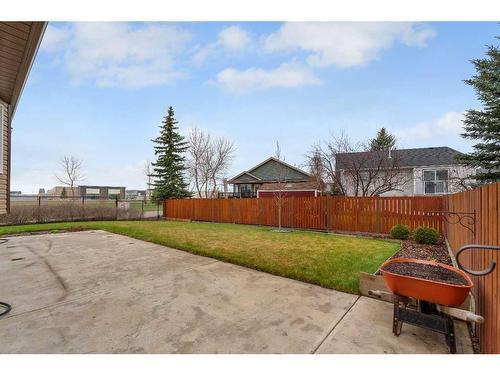 79 Riverstone Crescent Se, Calgary, AB - Outdoor With Backyard