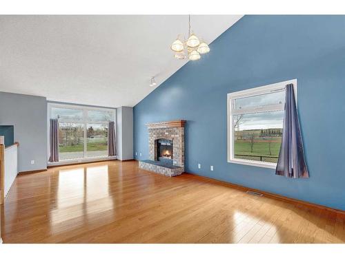 79 Riverstone Crescent Se, Calgary, AB - Indoor Photo Showing Living Room With Fireplace