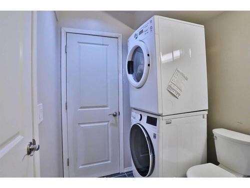 637 Woodbine Boulevard Sw, Calgary, AB - Indoor Photo Showing Laundry Room
