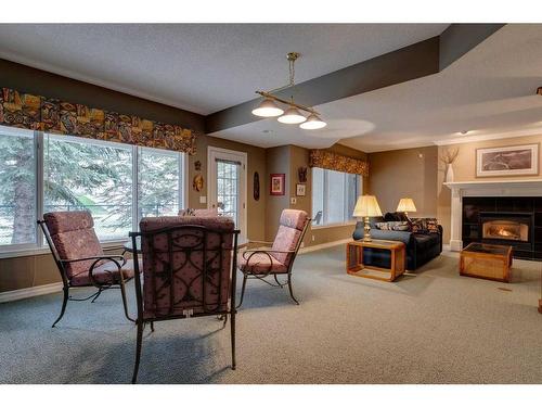 23 Prominence Point Sw, Calgary, AB - Indoor With Fireplace