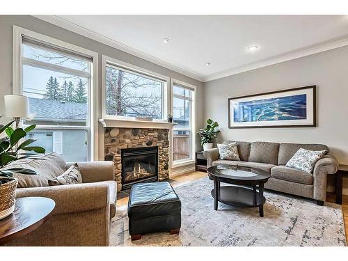 122 35 Street Nw, Calgary, AB - Indoor Photo Showing Living Room With Fireplace