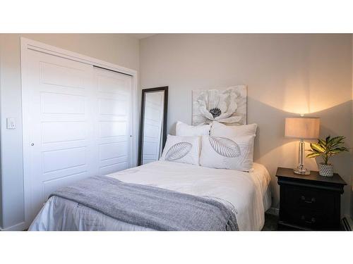 408-404 1 Avenue Se, Diamond Valley, AB - Indoor Photo Showing Bedroom