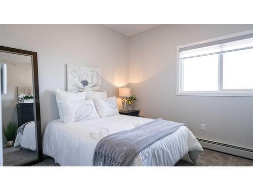 408-404 1 Avenue Se, Diamond Valley, AB - Indoor Photo Showing Bedroom
