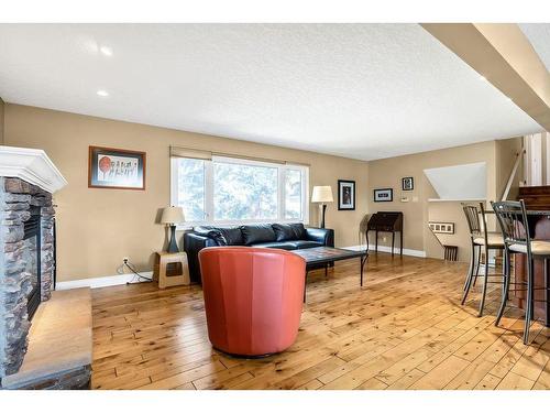 2715 48 Avenue Nw, Calgary, AB - Indoor Photo Showing Living Room With Fireplace