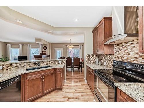 347 Silverado Boulevard Sw, Calgary, AB - Indoor Photo Showing Kitchen With Double Sink
