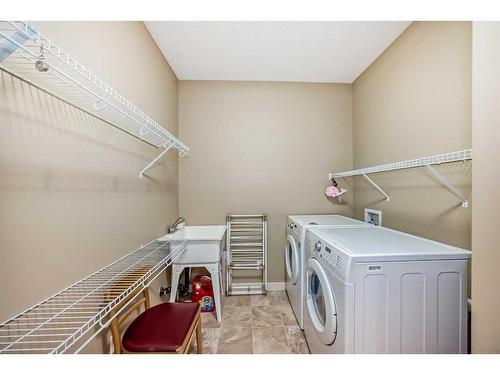 347 Silverado Boulevard Sw, Calgary, AB - Indoor Photo Showing Laundry Room