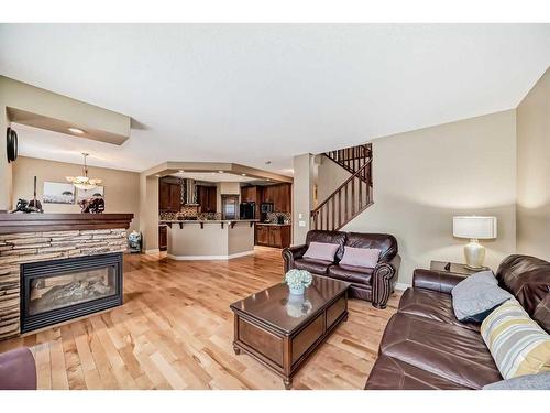 347 Silverado Boulevard Sw, Calgary, AB - Indoor Photo Showing Living Room With Fireplace