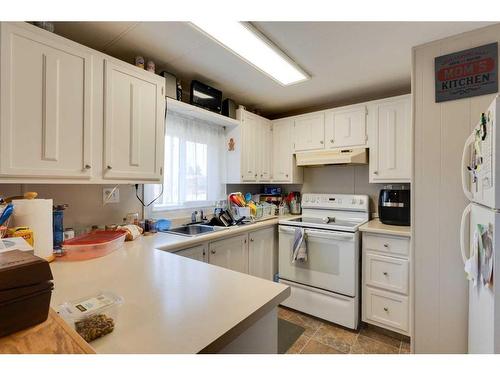1239 Downie Street, Carstairs, AB - Indoor Photo Showing Kitchen With Double Sink