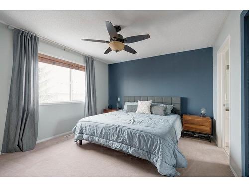 138 Rocky Ridge Circle Nw, Calgary, AB - Indoor Photo Showing Bedroom