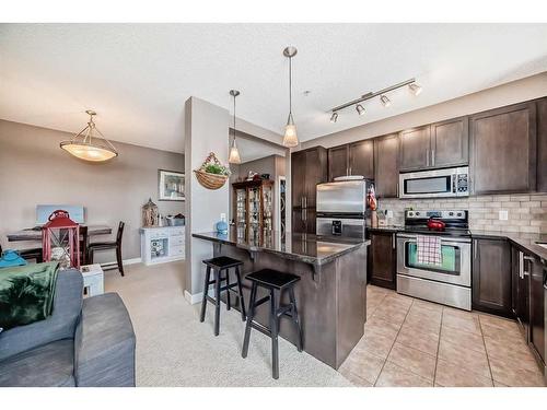 205-88 Arbour Lake Road Nw, Calgary, AB - Indoor Photo Showing Kitchen With Stainless Steel Kitchen With Upgraded Kitchen