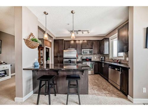 205-88 Arbour Lake Road Nw, Calgary, AB - Indoor Photo Showing Kitchen With Stainless Steel Kitchen With Upgraded Kitchen