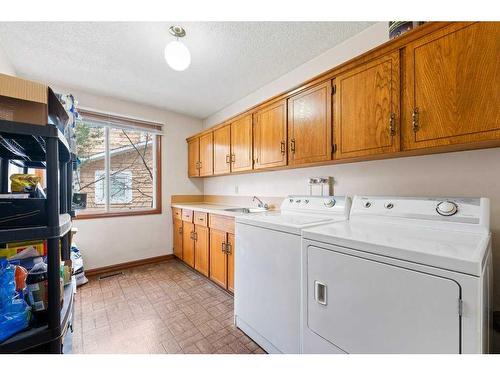 27 Strabane Place Sw, Calgary, AB - Indoor Photo Showing Laundry Room
