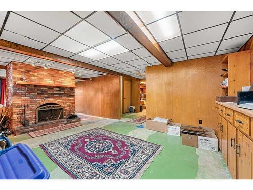 27 Strabane Place Sw, Calgary, AB - Indoor With Fireplace