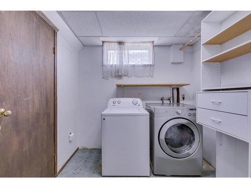 655 Woodpark Boulevard Sw, Calgary, AB - Indoor Photo Showing Laundry Room