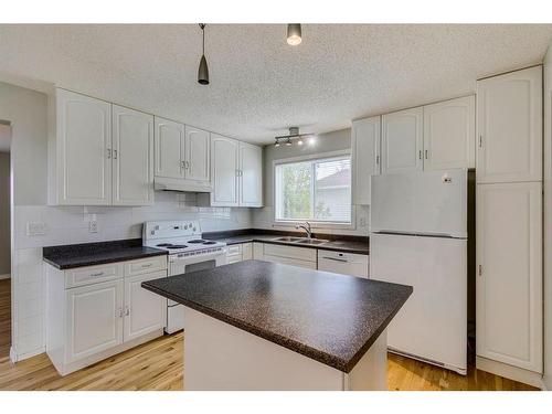 655 Woodpark Boulevard Sw, Calgary, AB - Indoor Photo Showing Kitchen With Double Sink