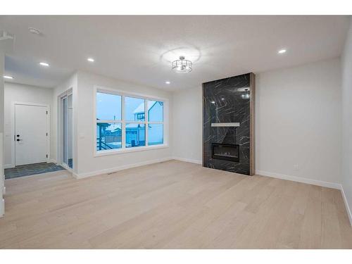 134 Alpine Drive Sw, Calgary, AB - Indoor With Fireplace