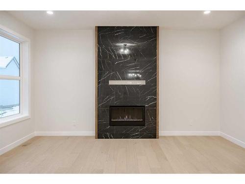 134 Alpine Drive Sw, Calgary, AB - Indoor With Fireplace