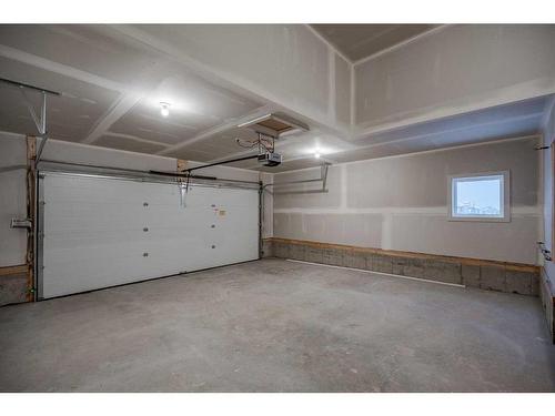 134 Alpine Drive Sw, Calgary, AB - Indoor Photo Showing Garage