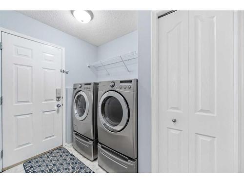 7830 Springbank Way Sw, Calgary, AB - Indoor Photo Showing Laundry Room