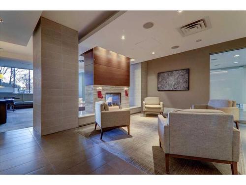 1526-222 Riverfront Avenue Sw, Calgary, AB - Indoor With Fireplace