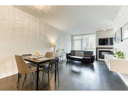 1526-222 Riverfront Avenue Sw, Calgary, AB - Indoor With Fireplace