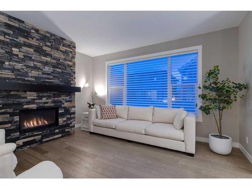 242 West Grove Point Sw, Calgary, AB - Indoor Photo Showing Living Room With Fireplace