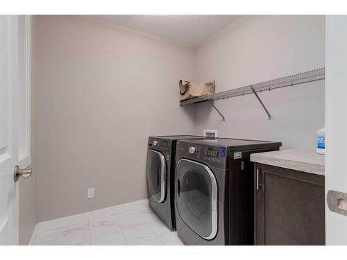 242 West Grove Point Sw, Calgary, AB - Indoor Photo Showing Laundry Room
