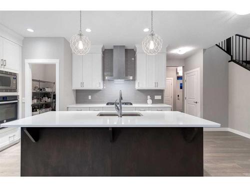 242 West Grove Point Sw, Calgary, AB - Indoor Photo Showing Kitchen With Double Sink With Upgraded Kitchen