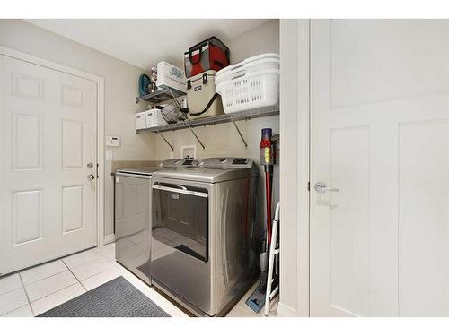 64 Reunion Close Nw, Airdrie, AB - Indoor Photo Showing Laundry Room