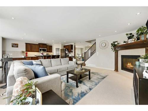 64 Reunion Close Nw, Airdrie, AB - Indoor Photo Showing Living Room With Fireplace