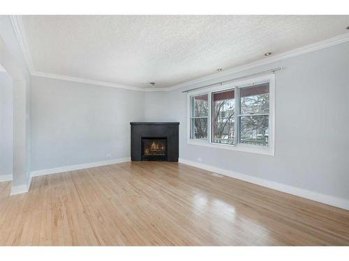 4529 Passchendaele Road Sw, Calgary, AB - Indoor Photo Showing Living Room With Fireplace