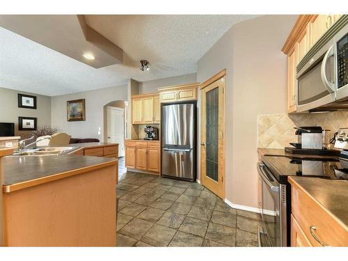 335 Cresthaven Place Sw, Calgary, AB - Indoor Photo Showing Kitchen With Stainless Steel Kitchen With Double Sink