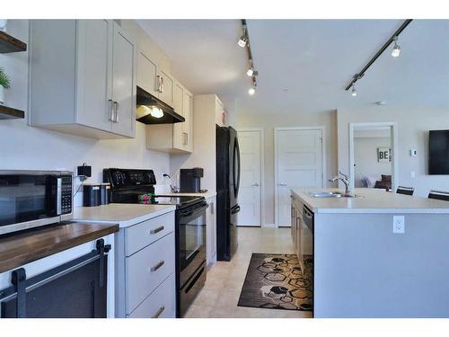 3309-450 Kincora Glen Road Nw, Calgary, AB - Indoor Photo Showing Kitchen With Double Sink