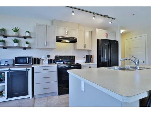 3309-450 Kincora Glen Road Nw, Calgary, AB - Indoor Photo Showing Kitchen With Double Sink