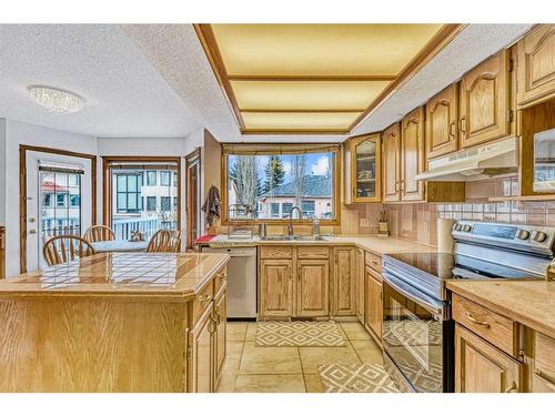 8328 Edgevalley Drive Nw, Calgary, AB - Indoor Photo Showing Kitchen With Double Sink