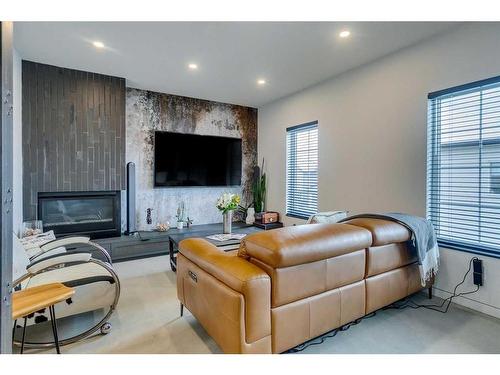 25 Elgin Meadows Green Se, Calgary, AB - Indoor Photo Showing Living Room With Fireplace