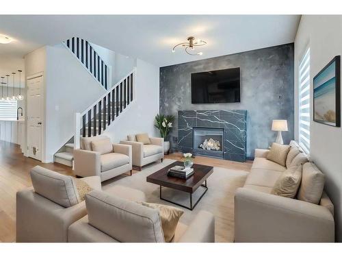 25 Elgin Meadows Green Se, Calgary, AB - Indoor Photo Showing Living Room With Fireplace