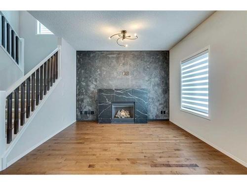 25 Elgin Meadows Green Se, Calgary, AB - Indoor With Fireplace