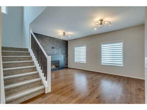 25 Elgin Meadows Green Se, Calgary, AB - Indoor With Fireplace