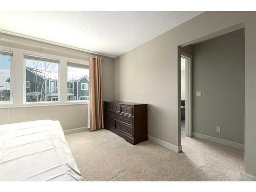 210 Aspen Stone Way Sw, Calgary, AB - Indoor Photo Showing Bedroom
