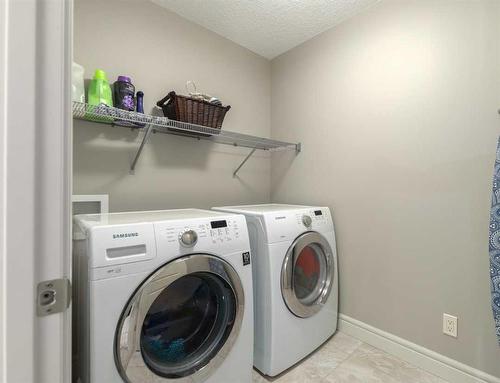 210 Aspen Stone Way Sw, Calgary, AB - Indoor Photo Showing Laundry Room