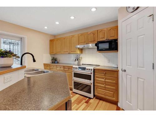 115 Valley Creek Crescent Nw, Calgary, AB - Indoor Photo Showing Kitchen With Double Sink