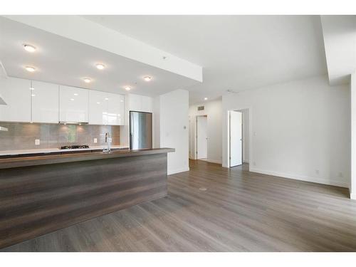 210-138 Waterfront Court Sw, Calgary, AB - Indoor Photo Showing Kitchen With Upgraded Kitchen