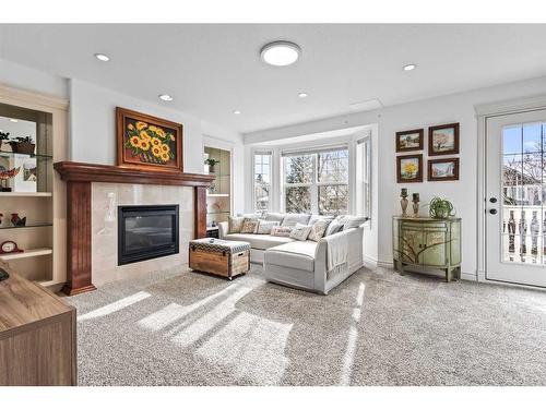 4024 Garrison Boulevard Sw, Calgary, AB - Indoor Photo Showing Living Room With Fireplace