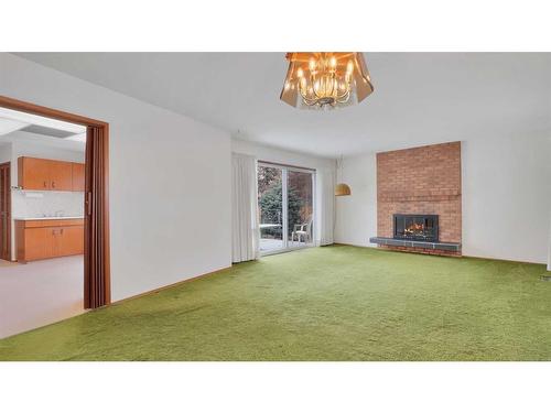 53 White Oak Crescent Sw, Calgary, AB - Indoor With Fireplace